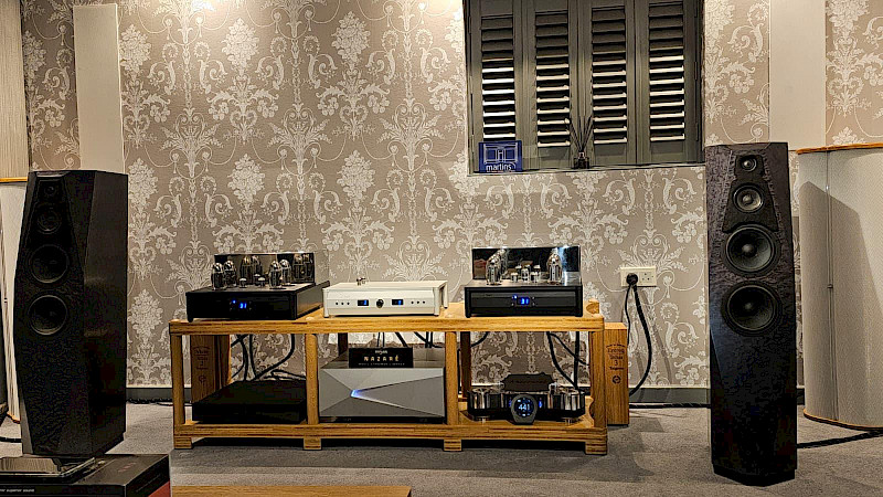 the lounge area including a sofa, armchair, window and ipda control unit at martins hifi demo room.