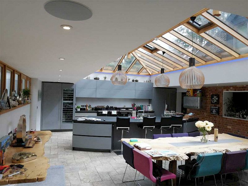 open plan kitchen and dinner with multiroom speakers and voice control lights