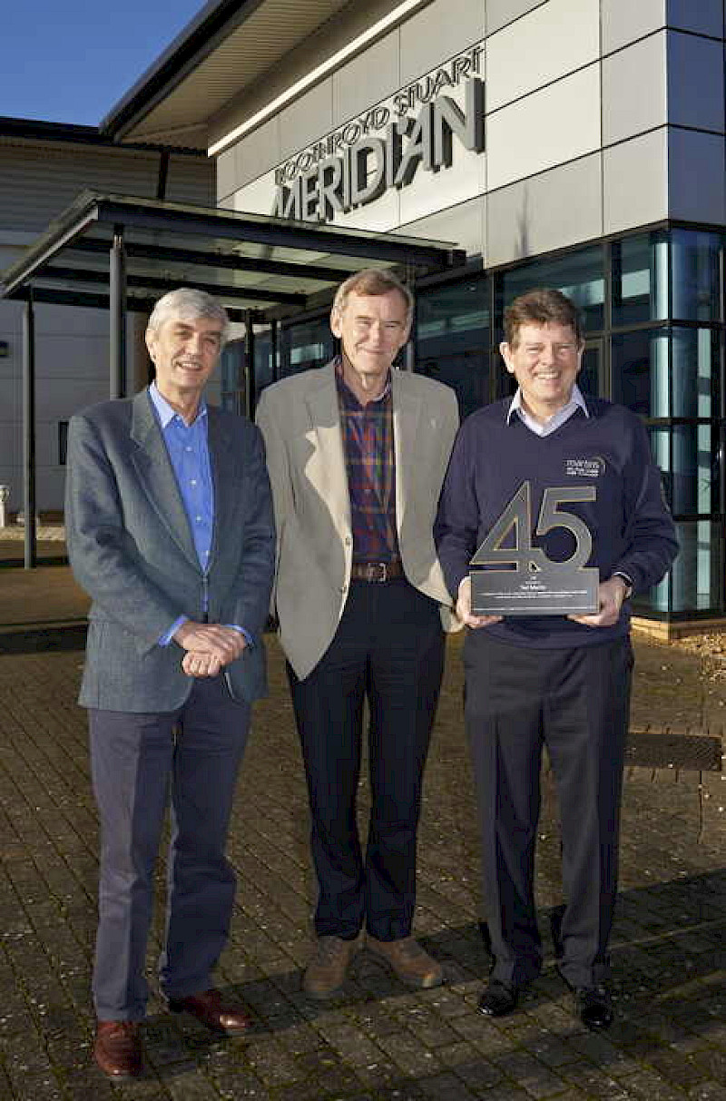 Ted with Bob and Allen presenting an award shaped in the number 45
