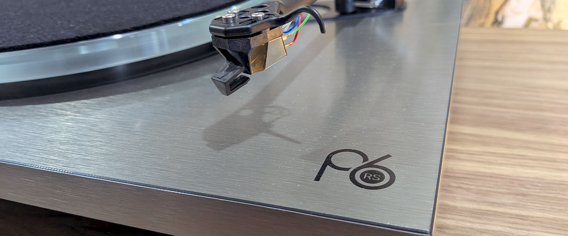 Close up of Rega Planar 6 RS logo on turntable - Martins Hi-Fi